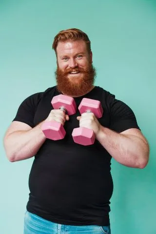 adult training with dumbbell