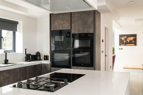 charcoal grey handleless modern kitchen