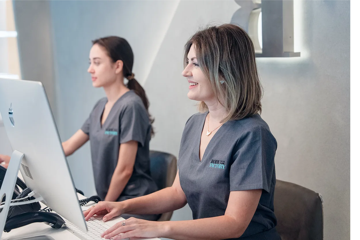 A BodyFactory clinician smiles during a monthly check-in at the studio