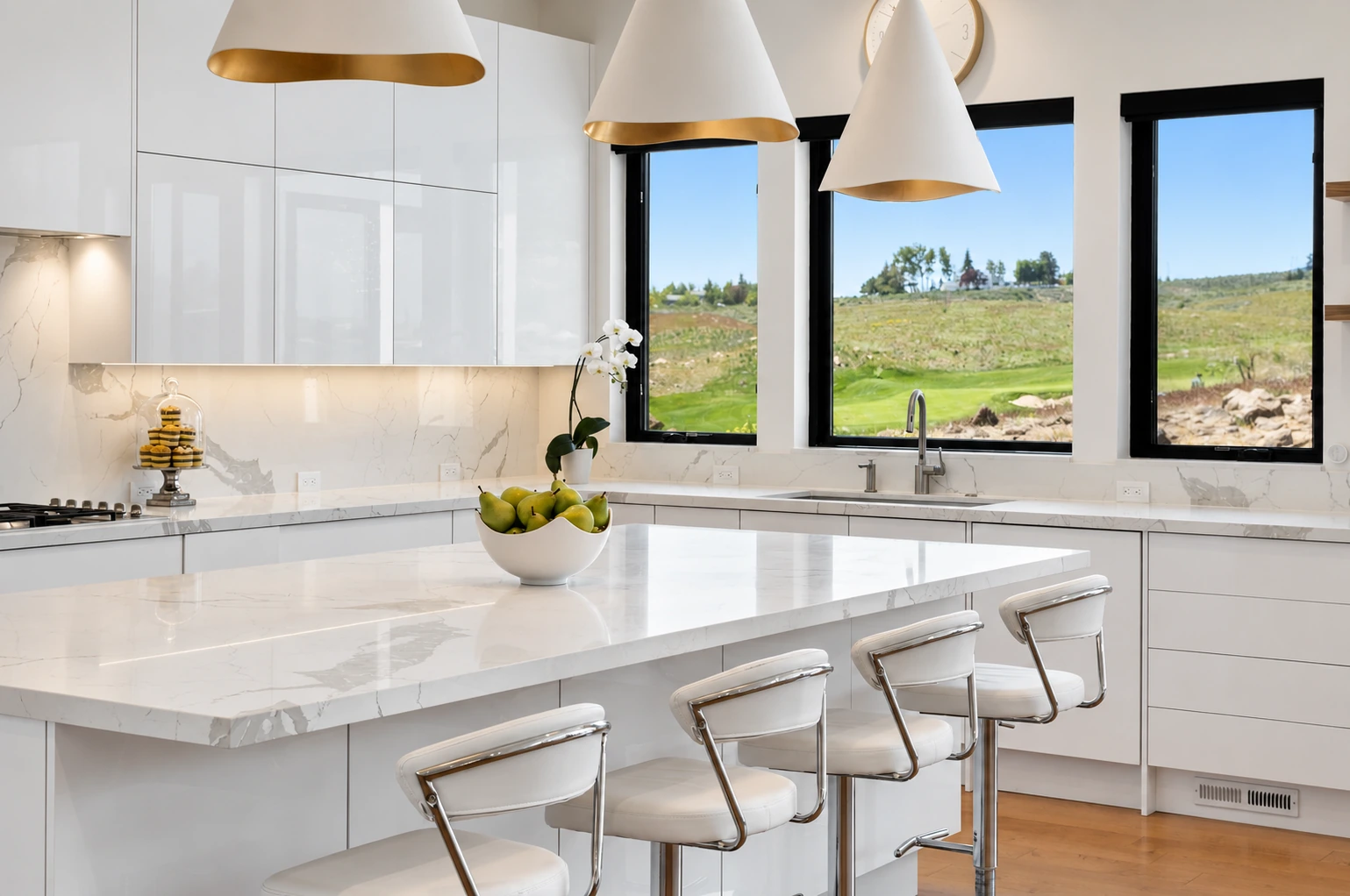White slab kitchen island with seating and broad windows