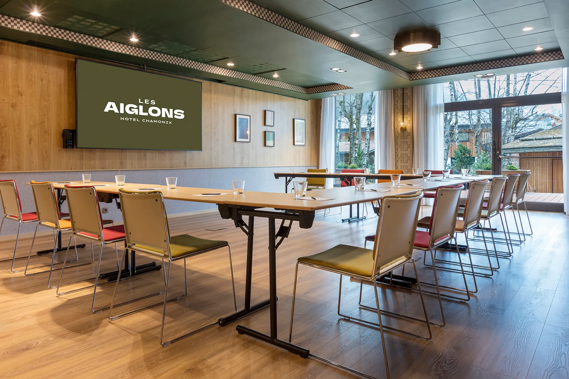 Stylish Aspen room with modern decor, natural lighting and technological equipment.