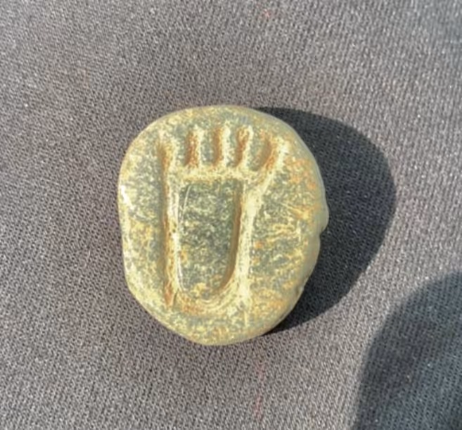 foot amulet found in site