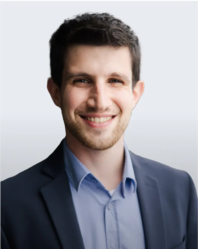 Headshot of Yonatan Itai, smiling with a neutral background.
