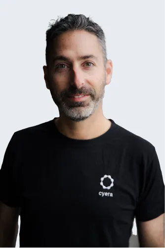 Headshot of Guy Gertner, smiling with a neutral background.