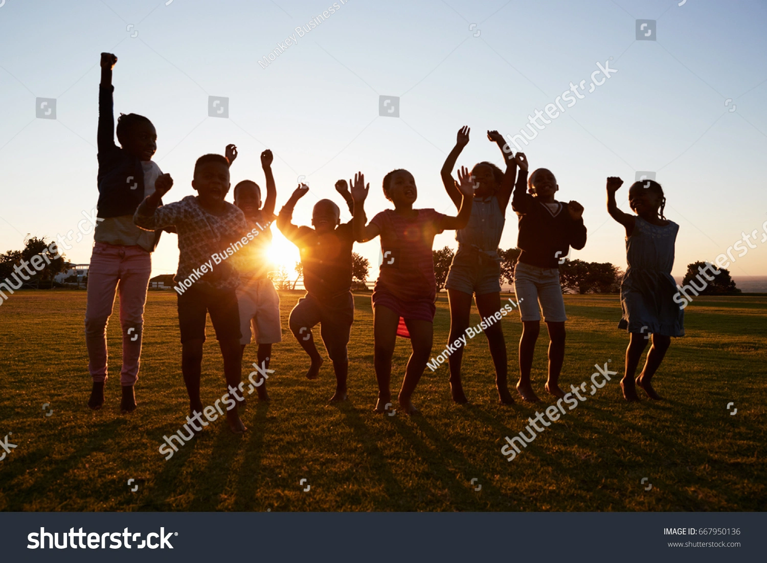 School kids jumping and celebrating