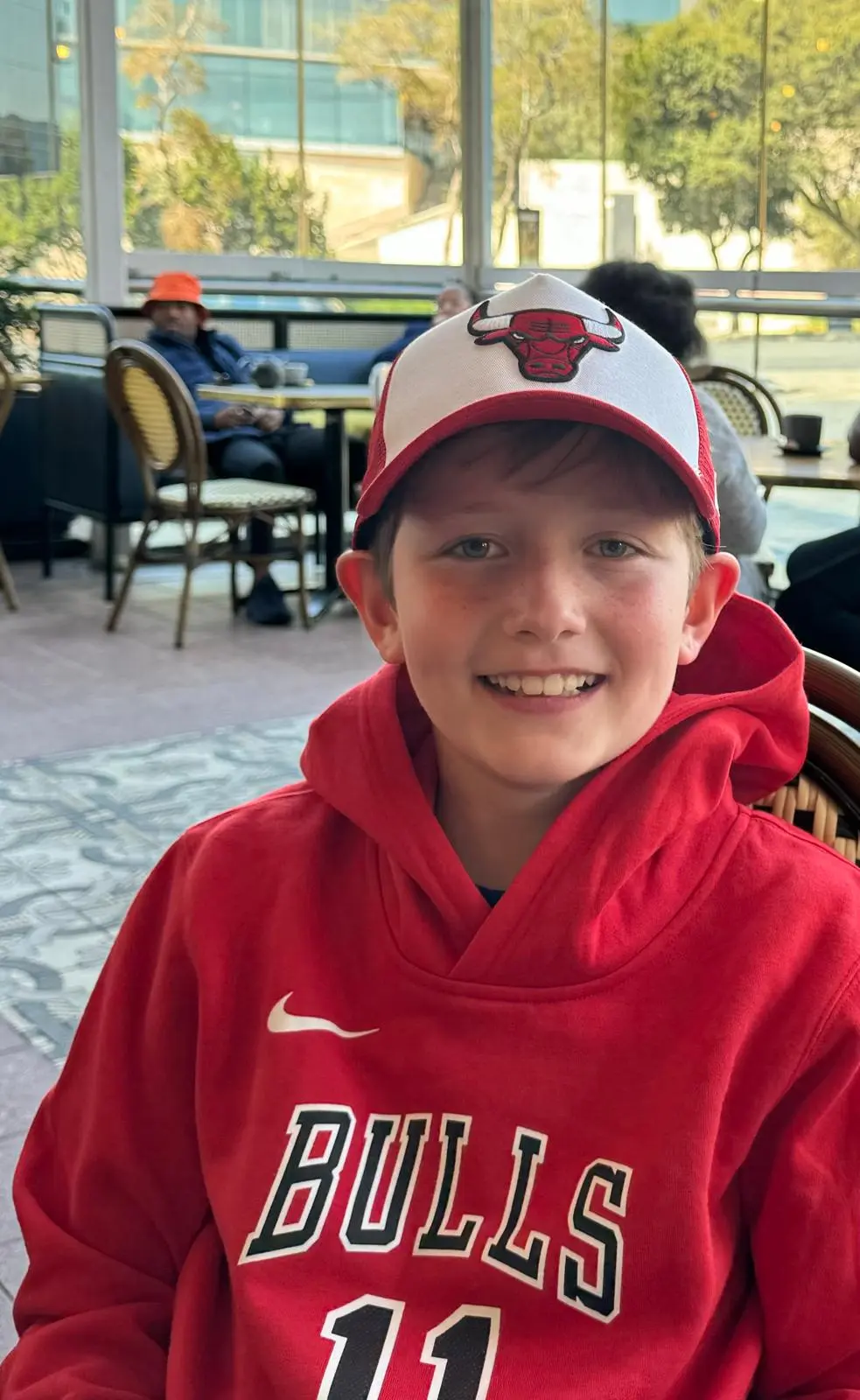 Maddoc wearing a Bulls hoodie and Bulls cap