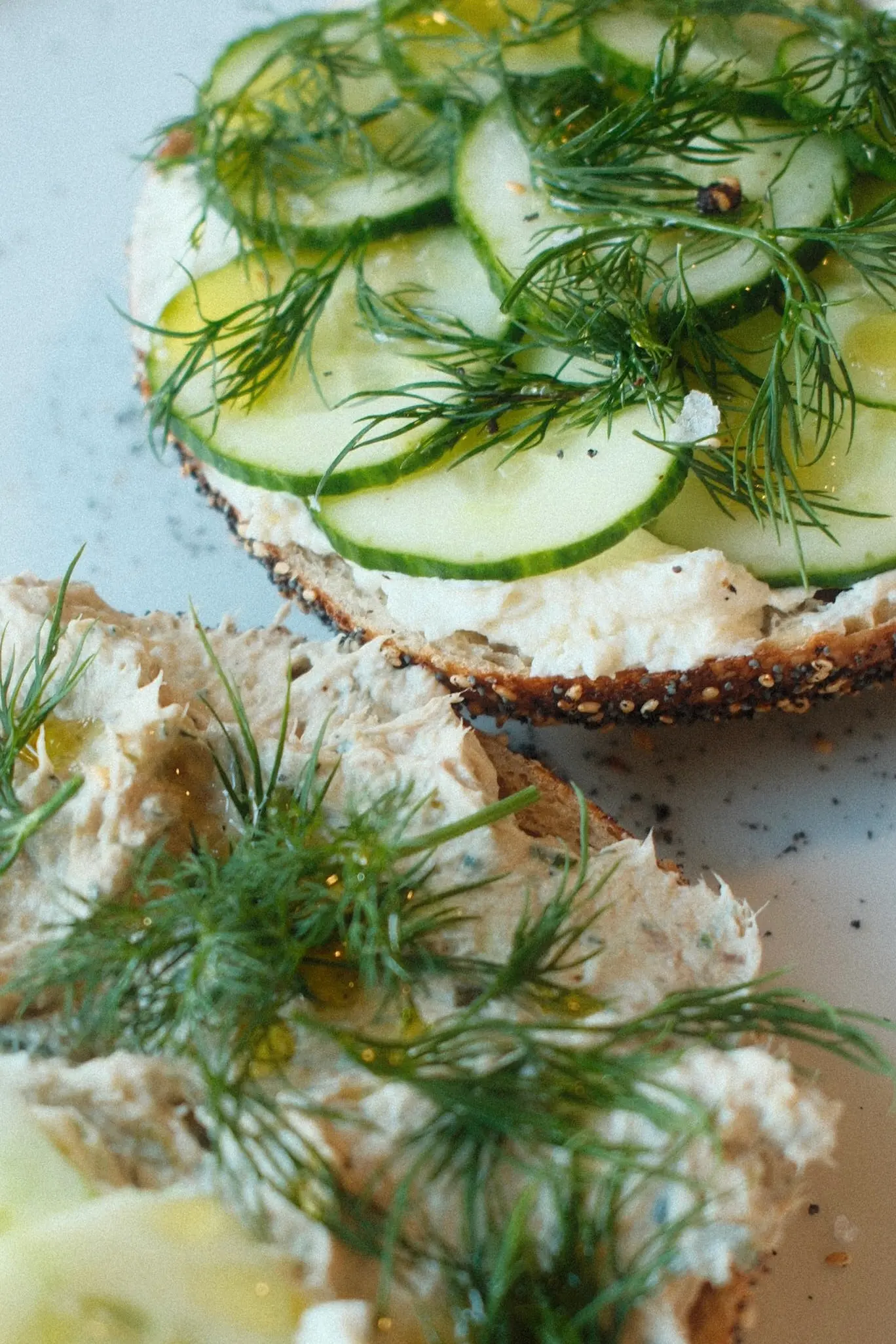 Freshly baked bagel with fresh vegetable toppings.