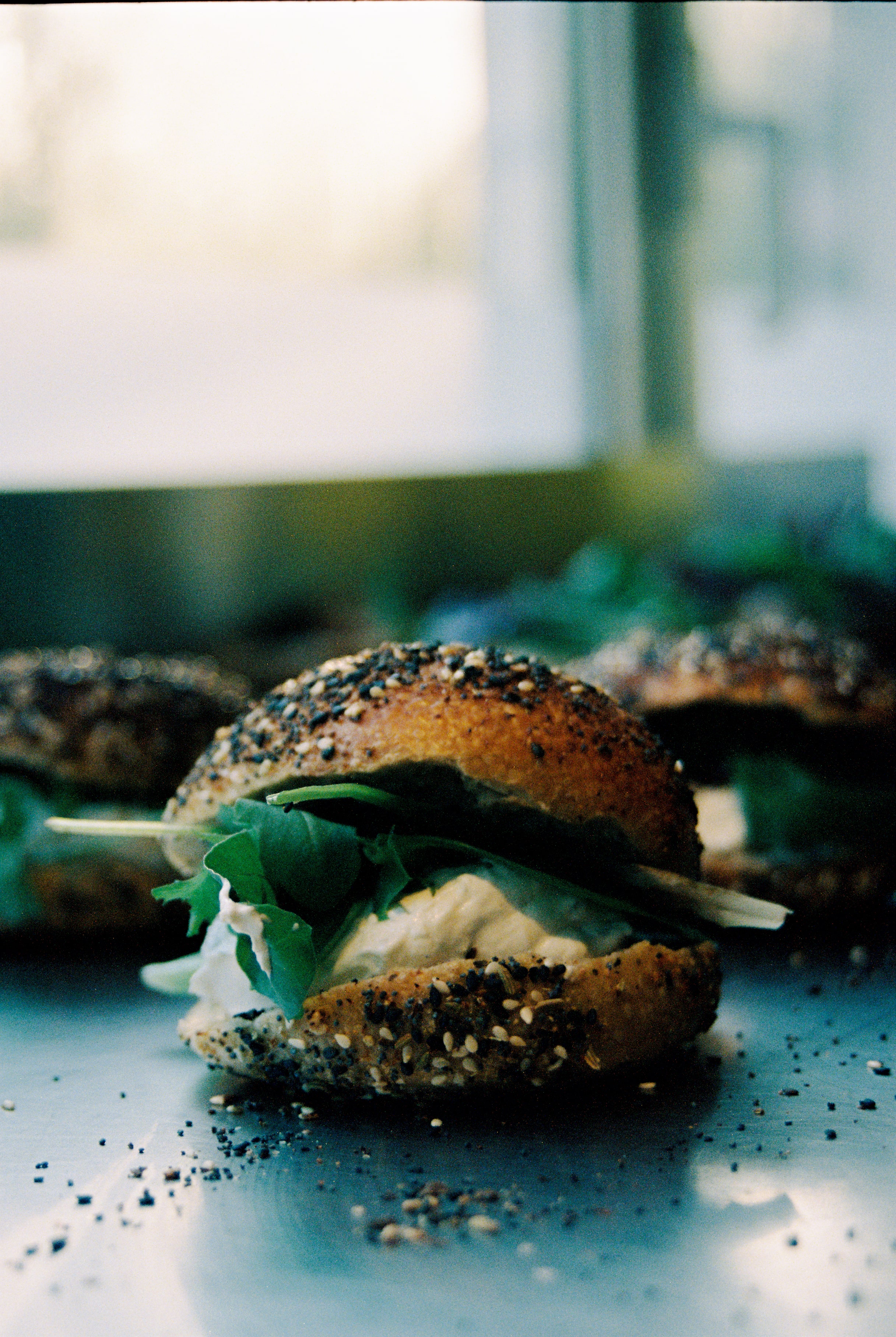 Freshly baked bagels bursting with ingredients. 