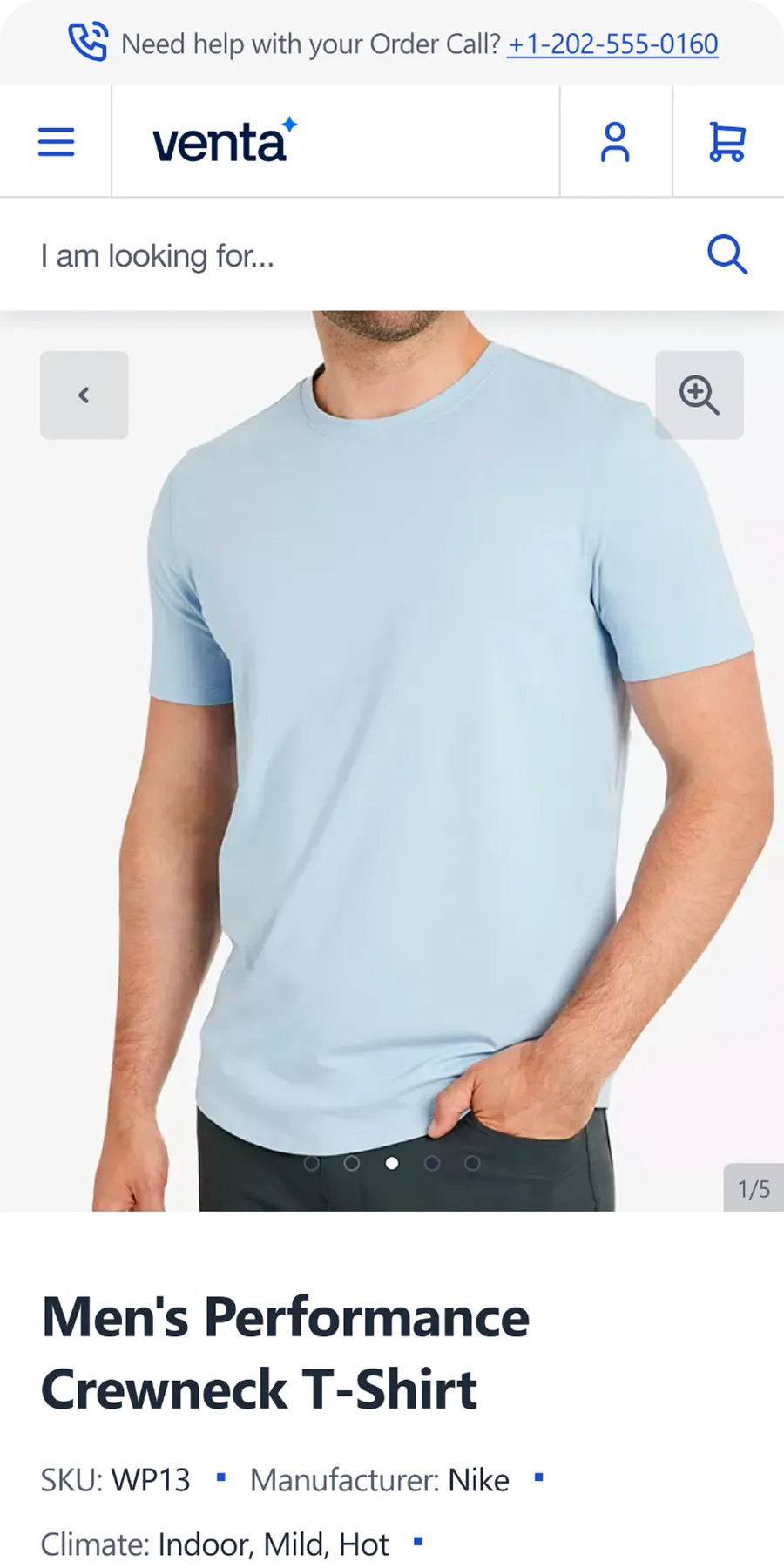 Man wearing a light blue men's performance crewneck T-shirt with short sleeves.