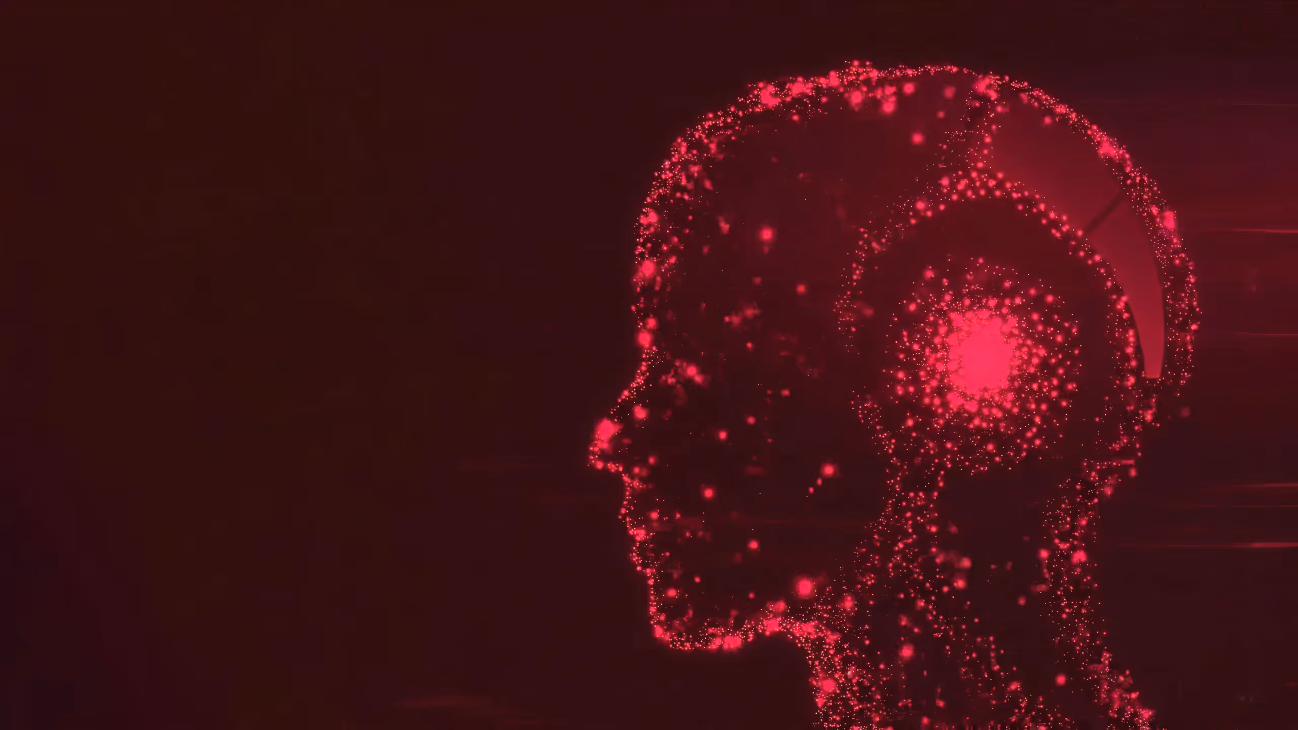 Glowing red digital profile of a human head made of particles with a bright spot in the brain area on a dark background.