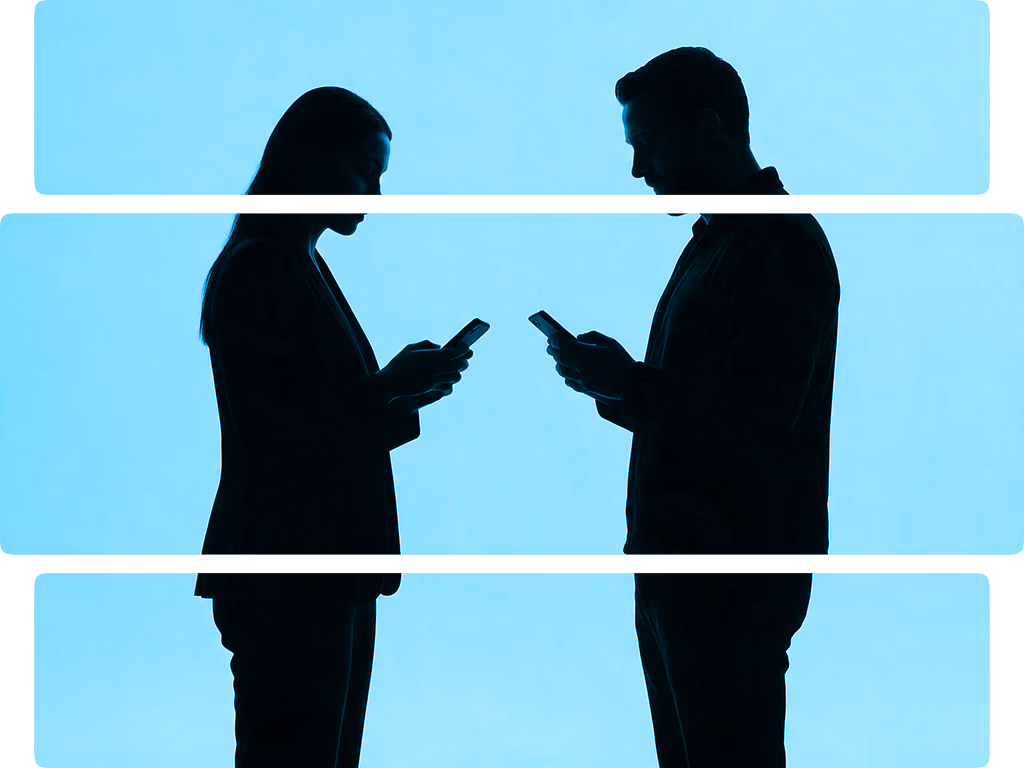 Silhouettes of a man and woman facing each other, both looking at their smartphones.