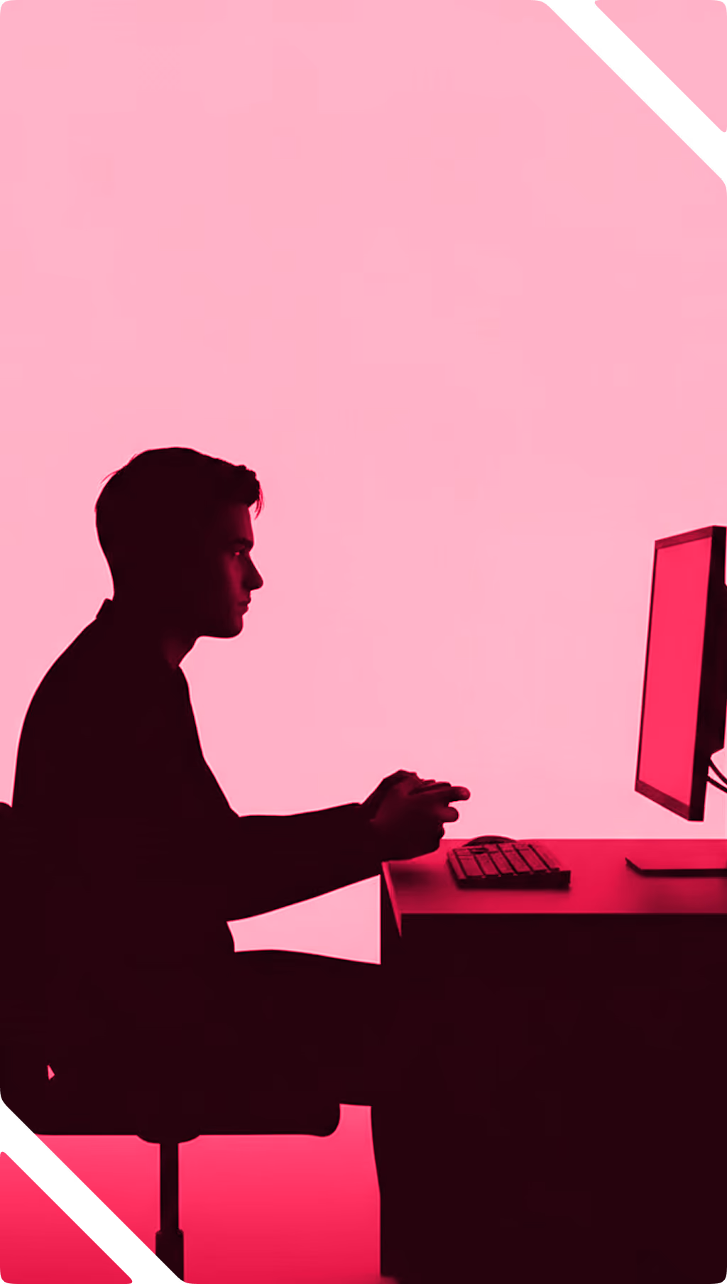 Silhouette of a man sitting at a desk using a computer with a pink background.