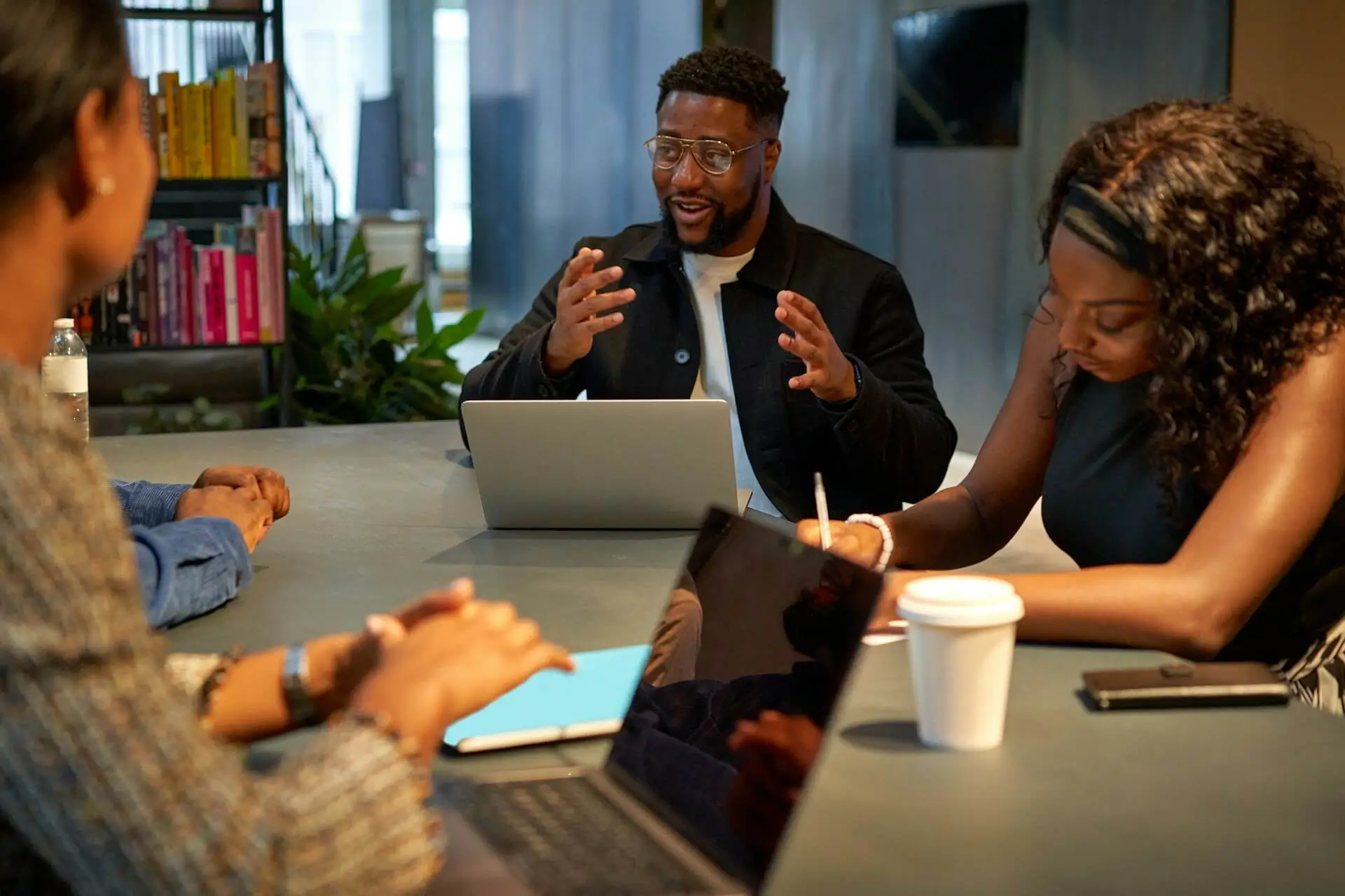 Team meeting in a modern office with professionals discussing digital strategy