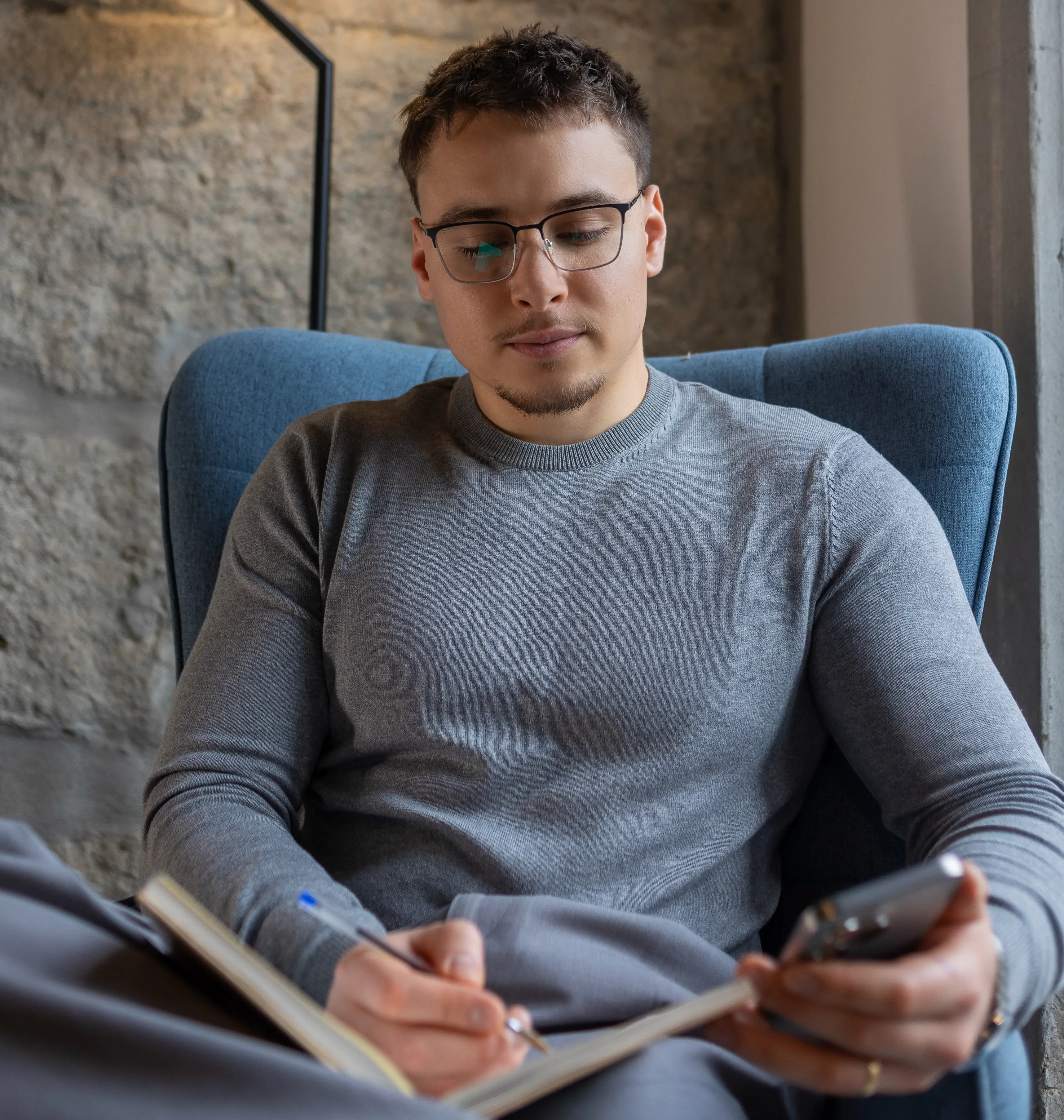 Mykola Ledenov UX designer reviewing mobile interface wireframes and user journey concepts