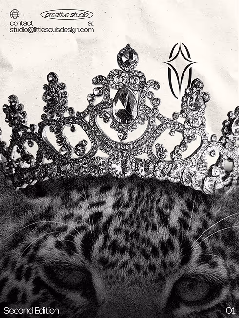 Close-up of a leopard's face with a jeweled crown resting on its head in black and white.