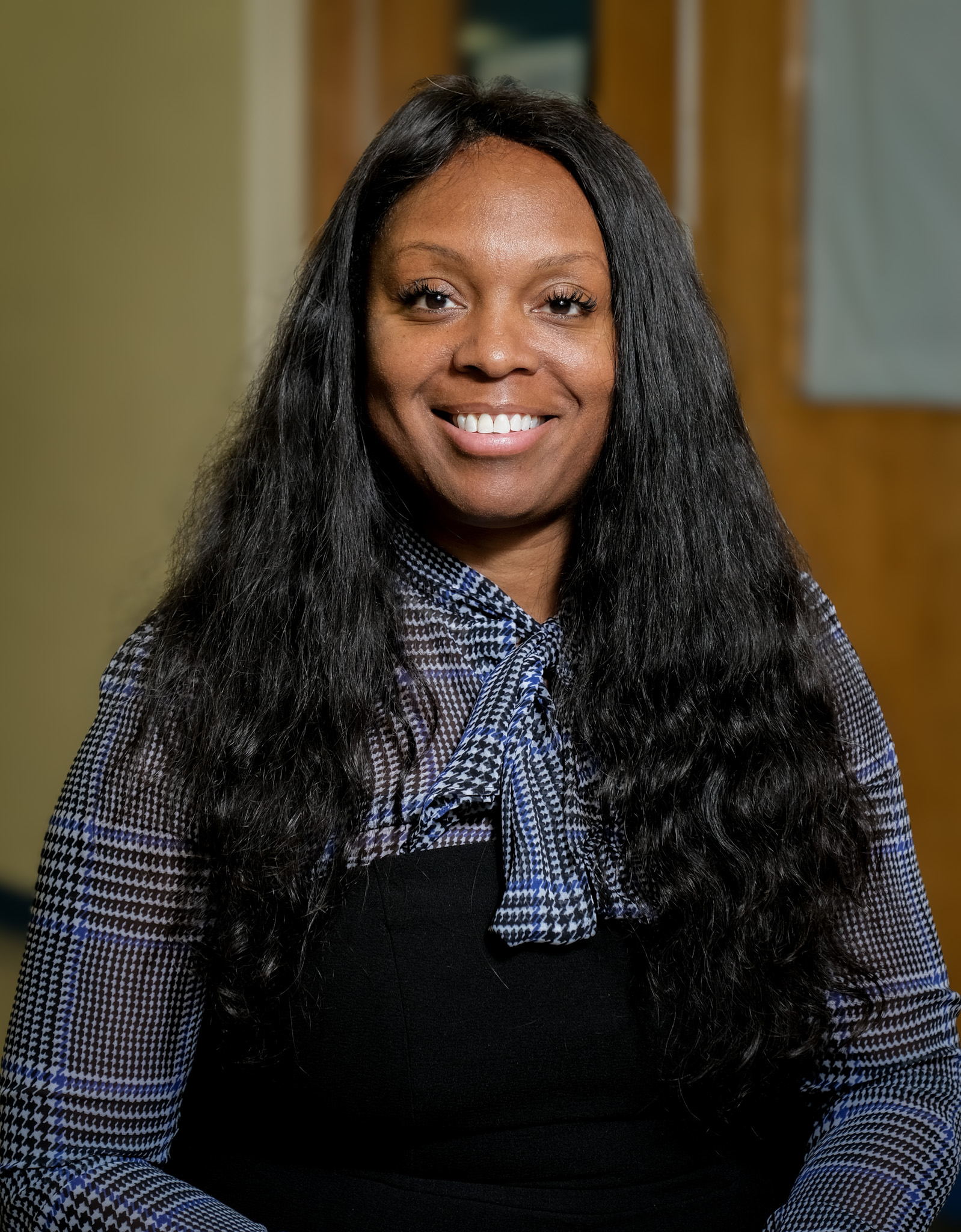 Anya Munce smiling in a professional staff portrait