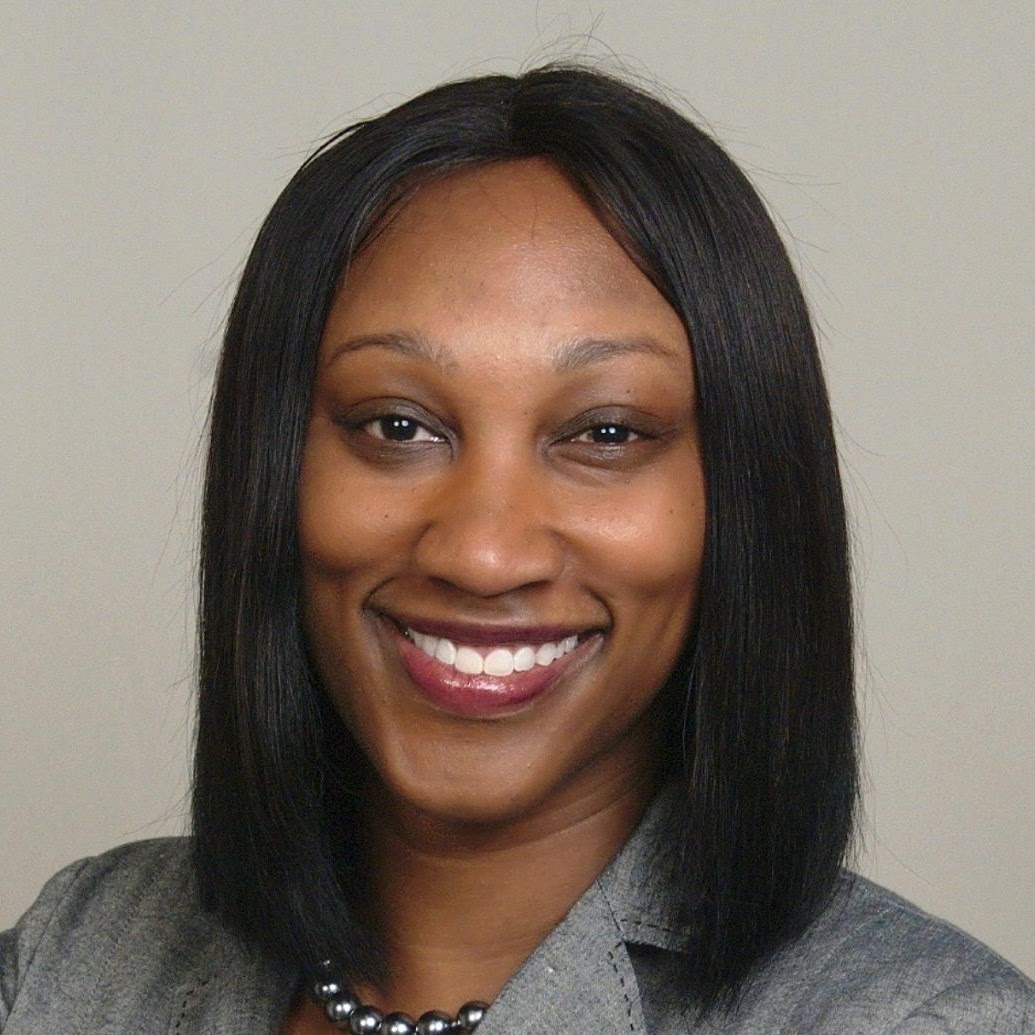Camille Kinlock smiling in a professional headshot portrait
