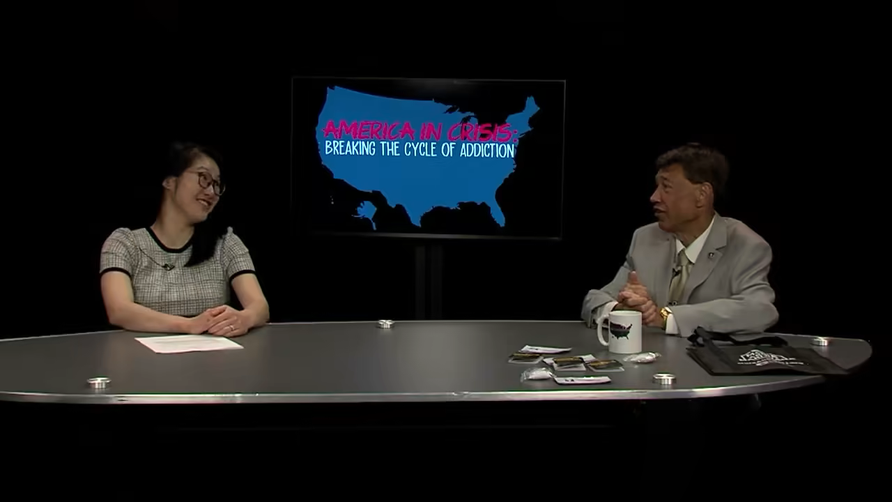 Dr. SJ Fletcher of Lumin Health speaking with host David Hunt on Woburn Public Media's America in Crisis podcast.