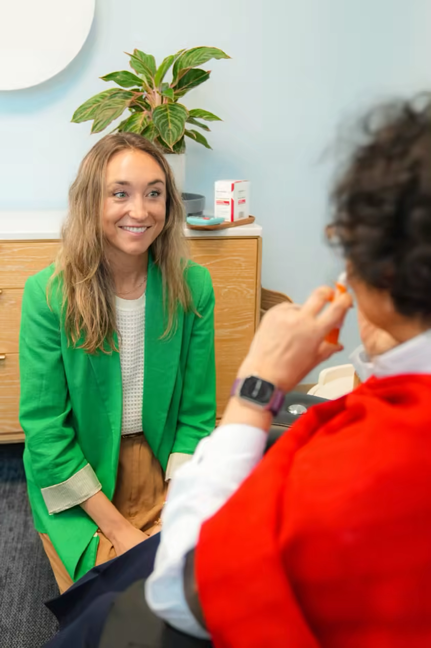 Patient self-administering the Spravato nasal spray with clinician support