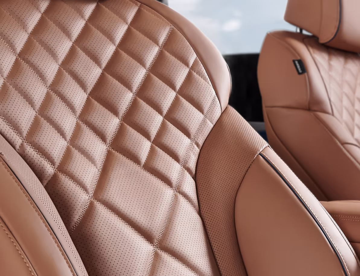 Interior of GV80 cockpit from passenger’s side window, quilted Nappa leather seats