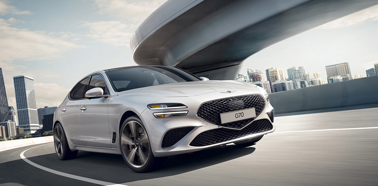 Silver G70, driving around a curve