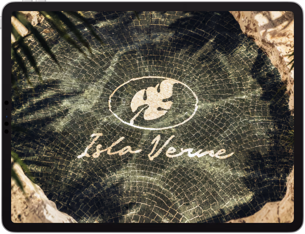 Isla Verne logo embossed on tree bark, shown on iPad