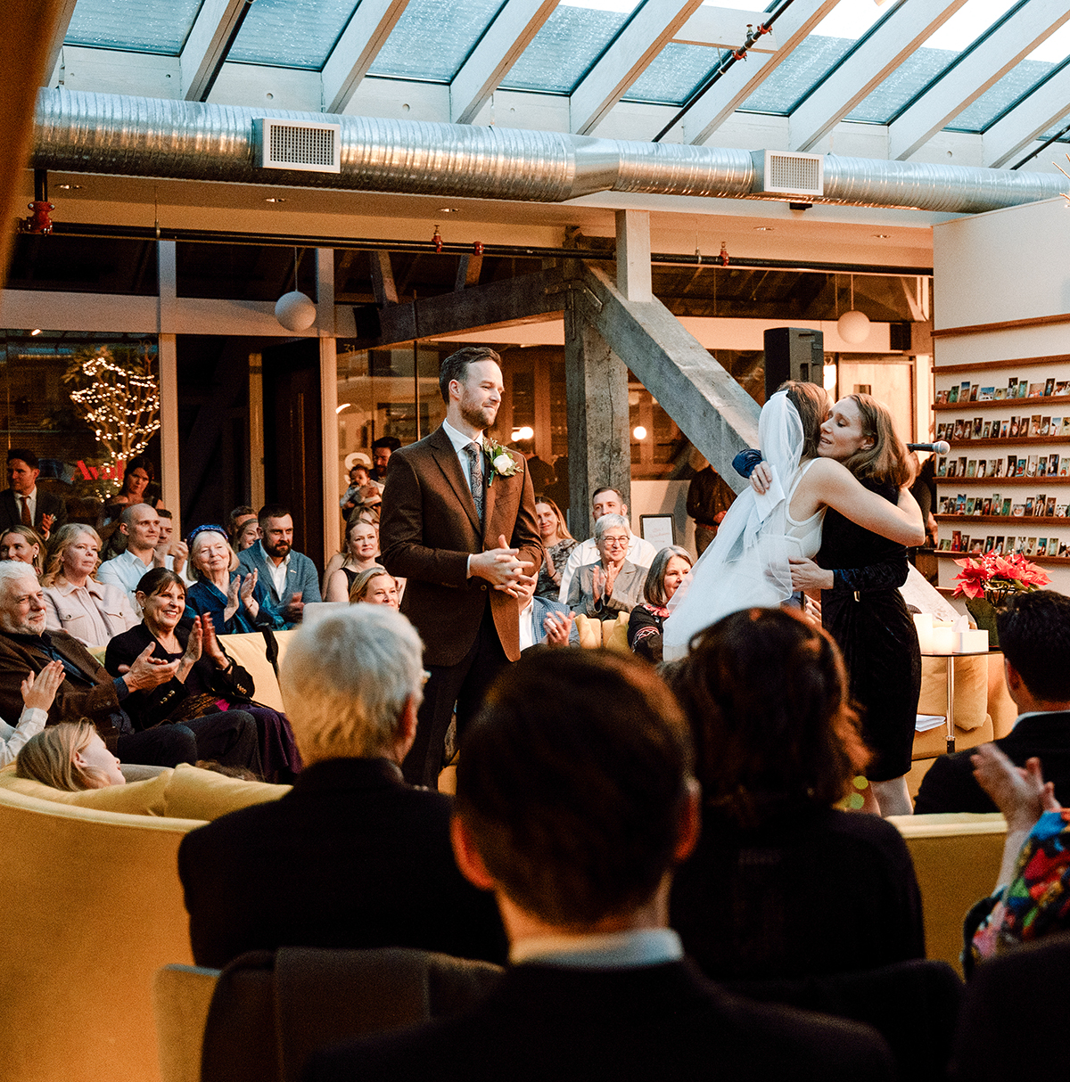 Guests watching a large event in the KWENCH Lounge.