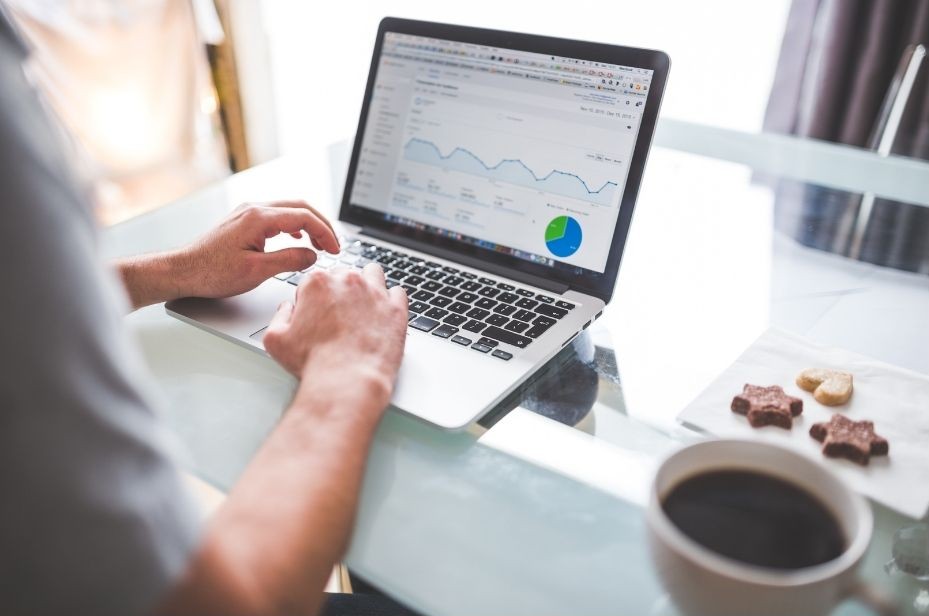 A laptop screen showing Google ad campaign analytics.