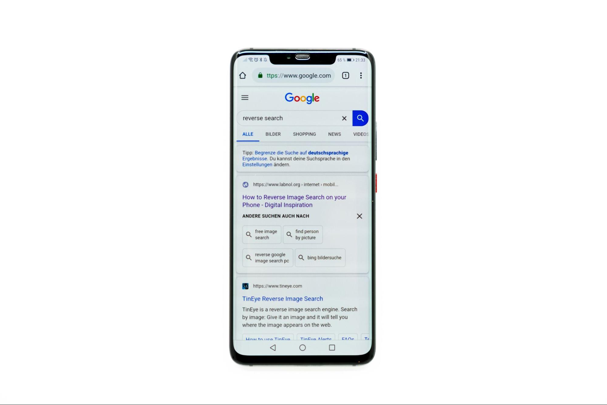 A mobile screen showing top Google search results for a ‘reverse search’ query.