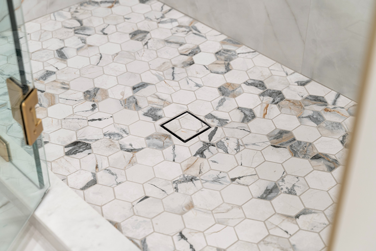 Walk-in shower in Bothell with mosaic floor tile  
