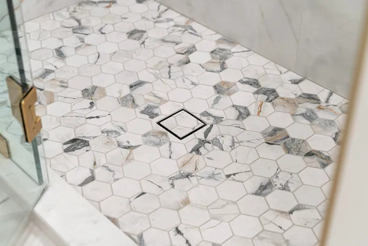 Walk-in shower in Bothell with mosaic floor tile  