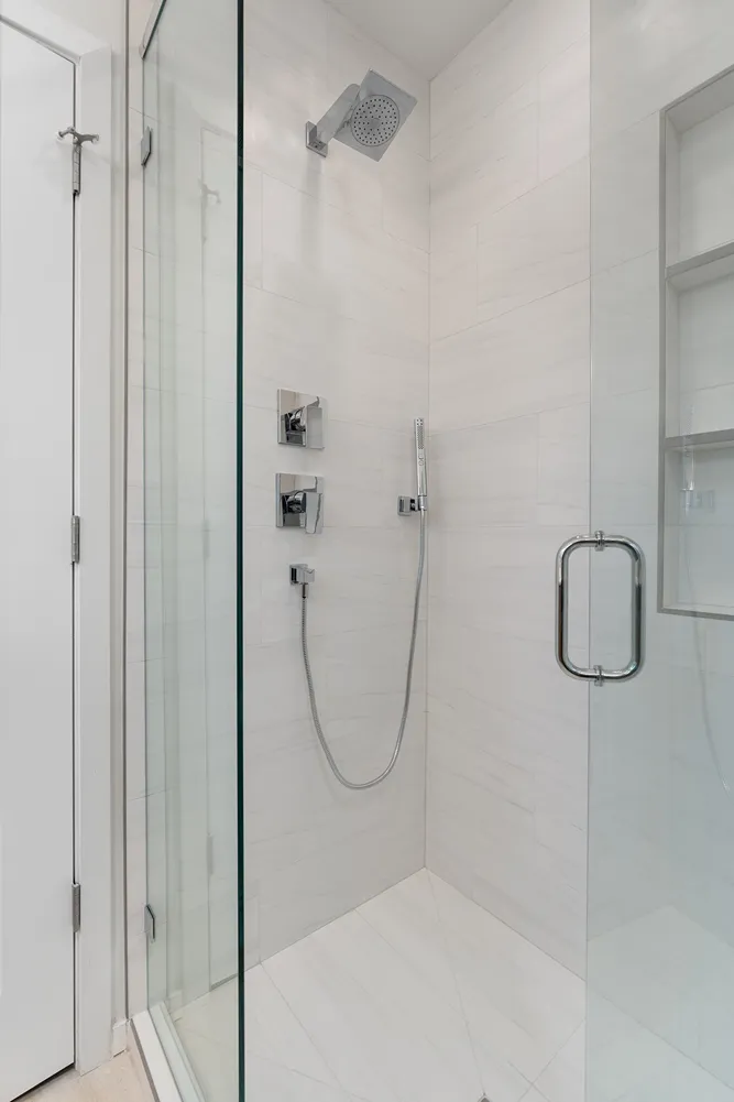 Small bathroom in Bothell converted from tub to walk-in shower with light tile