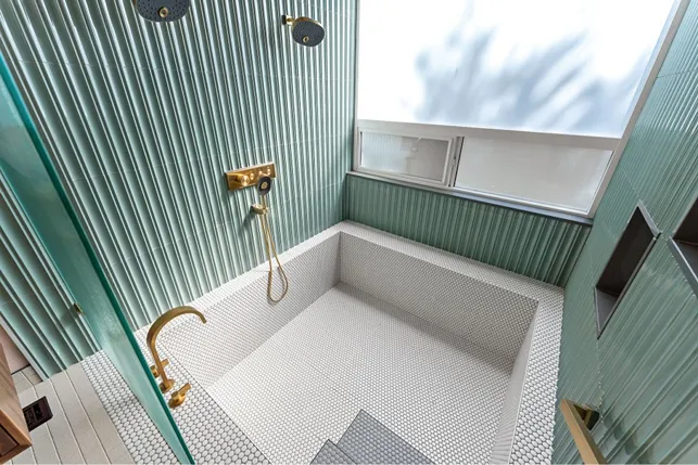  Walk-in shower with slip-resistant flooring for aging homeowners' safety