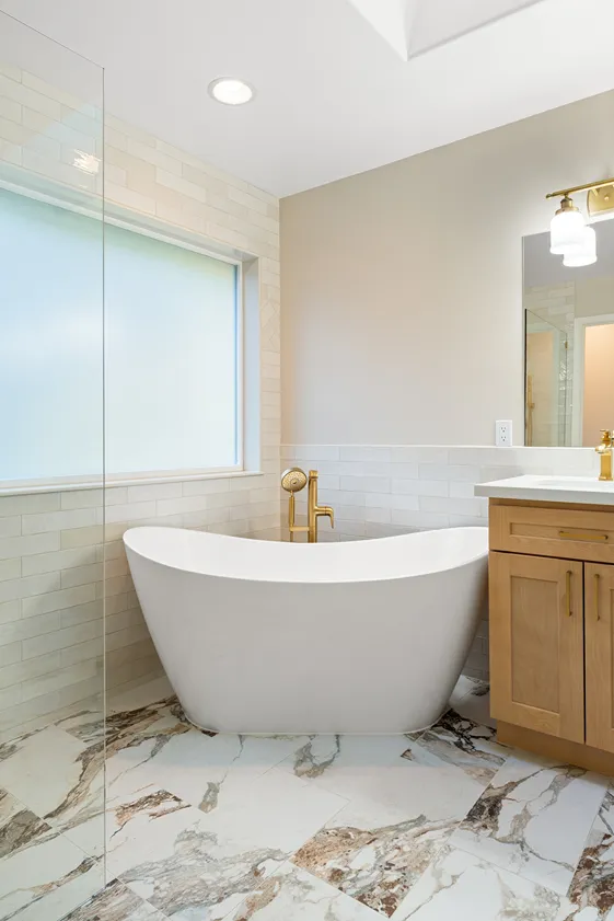 Freestanding tub and granite tile flooring in a Bothell bathroom
