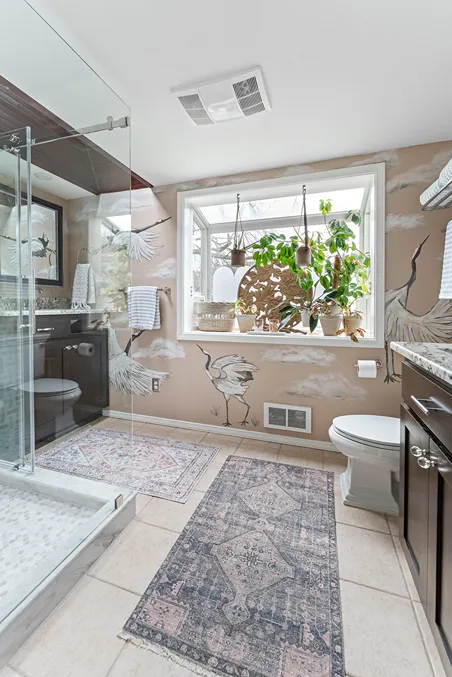 Remodeled bathroom in Bothell with carpets, walk-in shower, and newly refaced cabinet