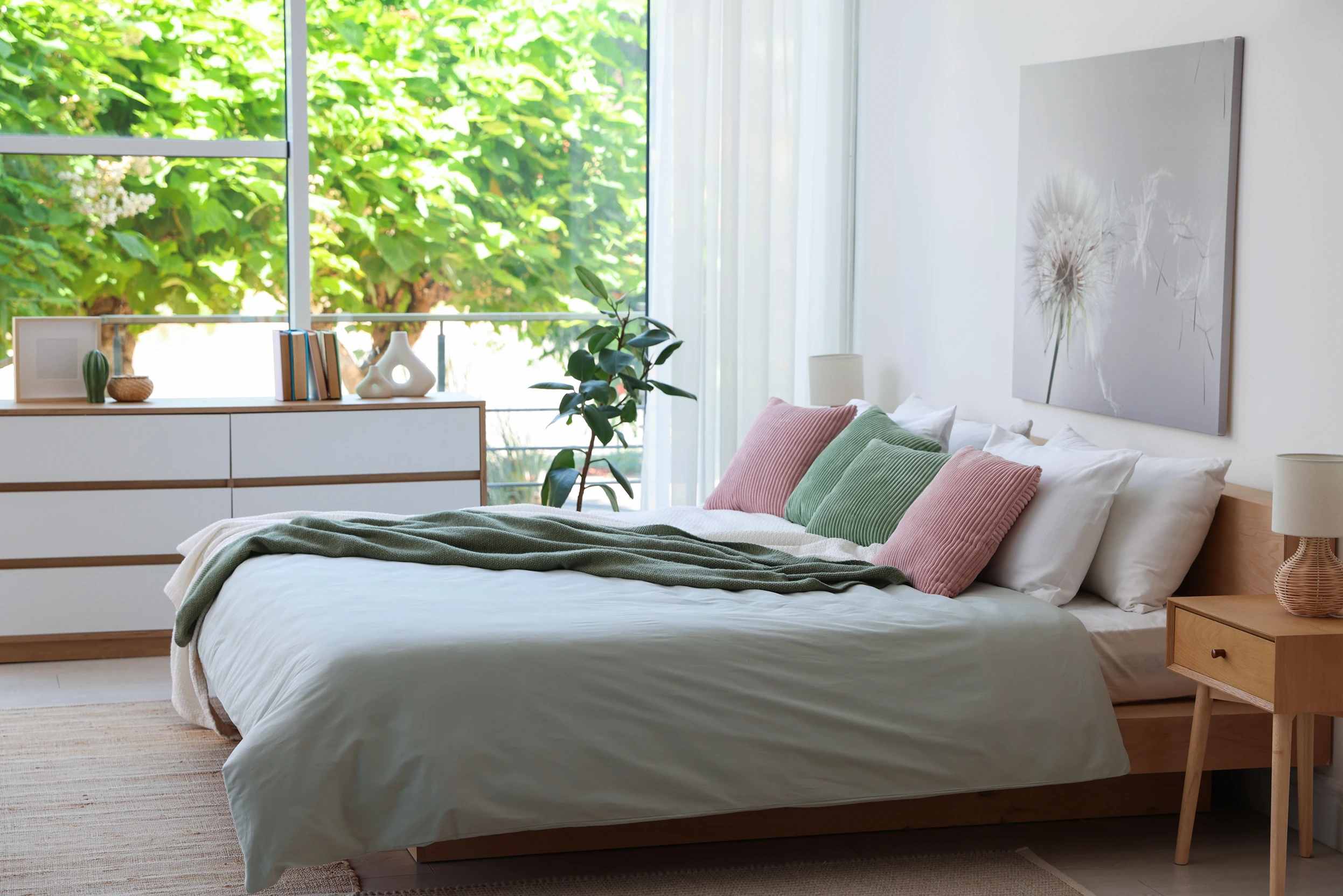A newly built guest bedroom with pillows and bookcase