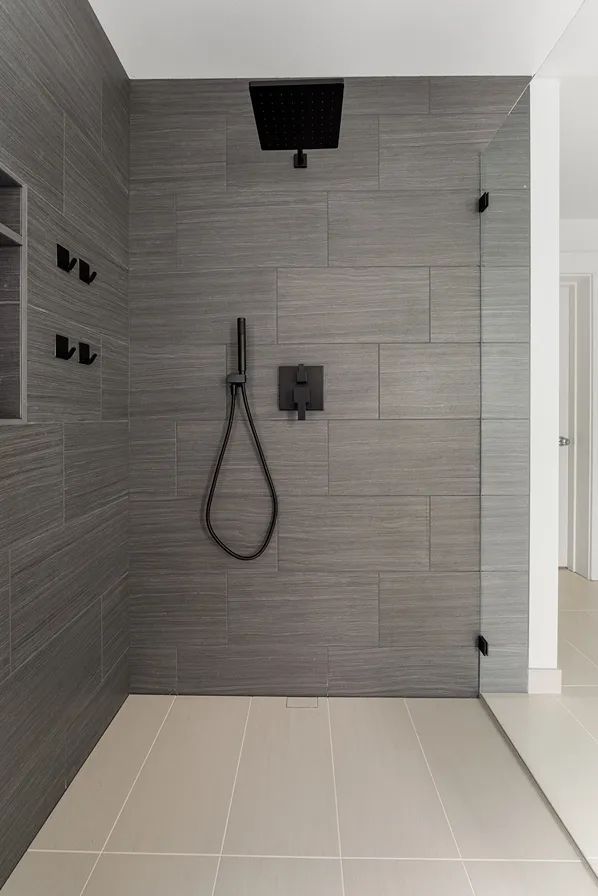 Newly remodeled shower in Bothell with natural stone wall tiles