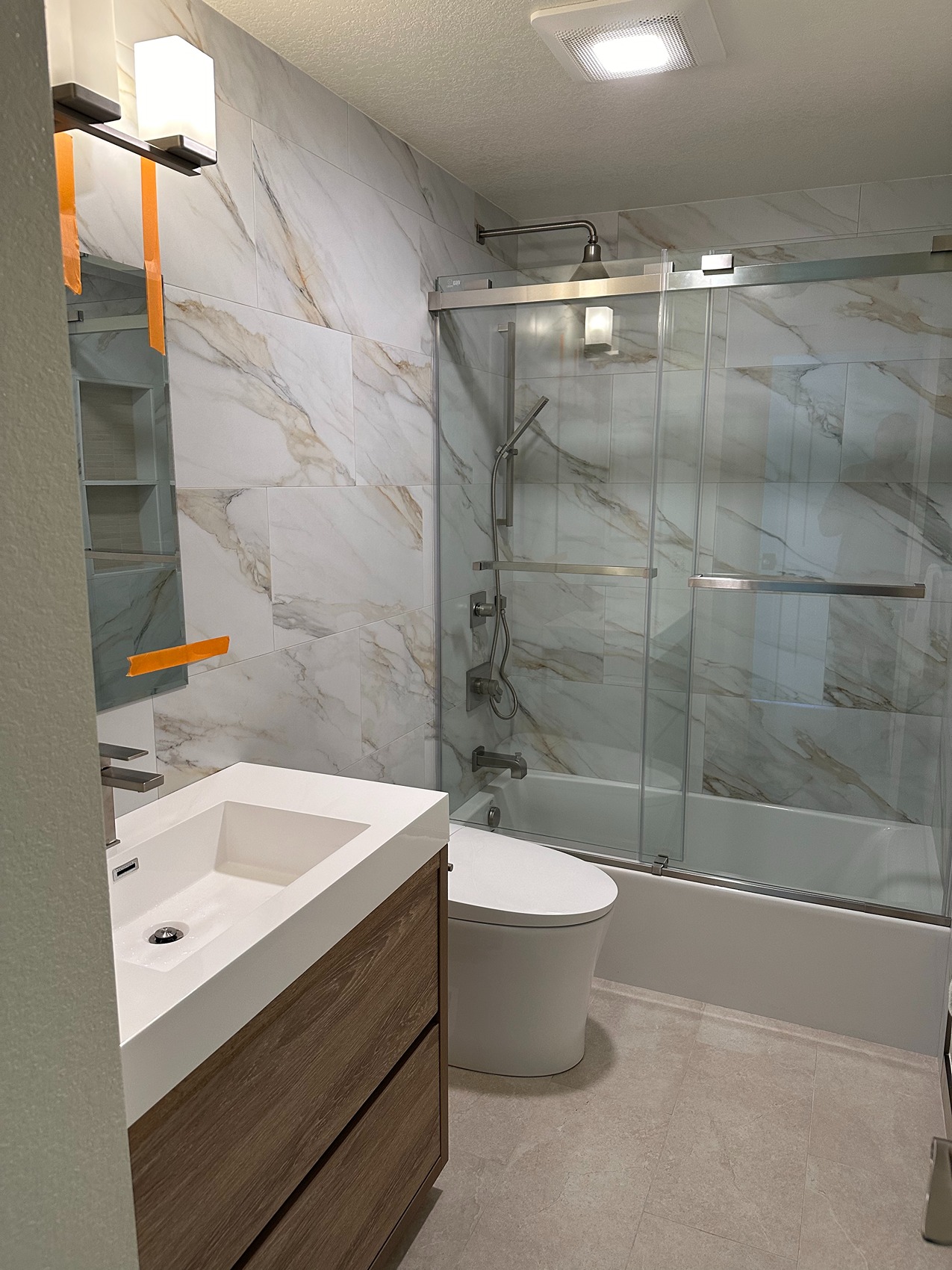 Combined Style and Comfort in a Sophisticated Bathroom Process Image 