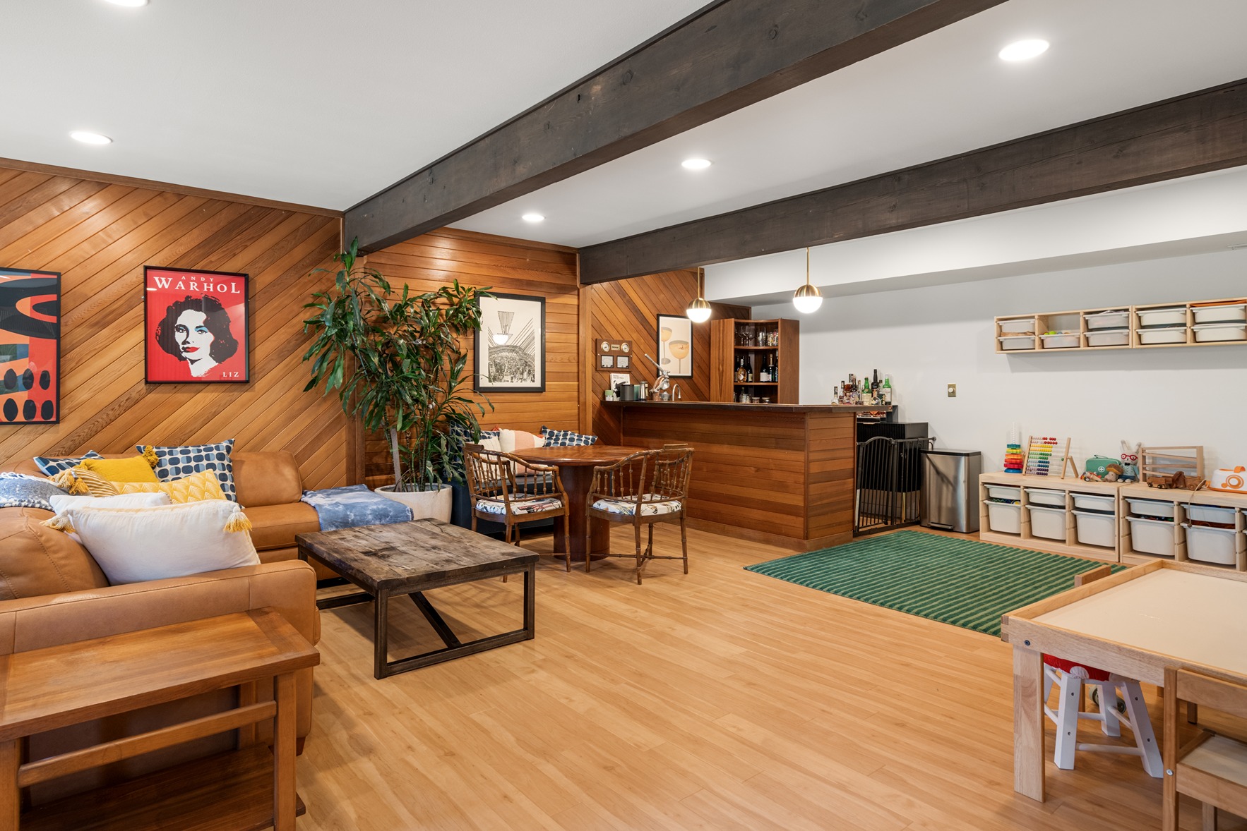 Bright mid-century–inspired living area with wood slat accent walls