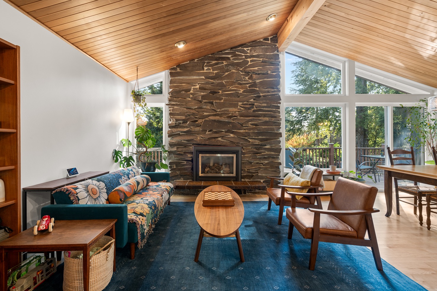An open living room with natural light and maple hardwood floors