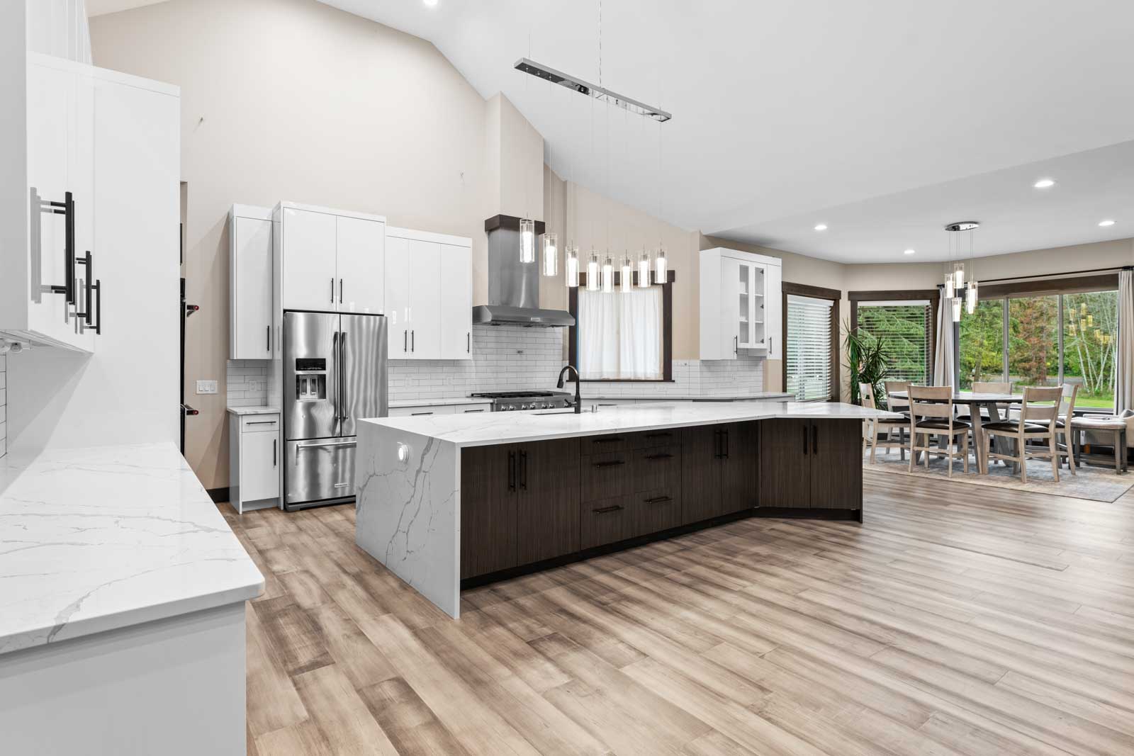 A fully remodeled kitchen with wooden flooring and white countertops in a Bothell home