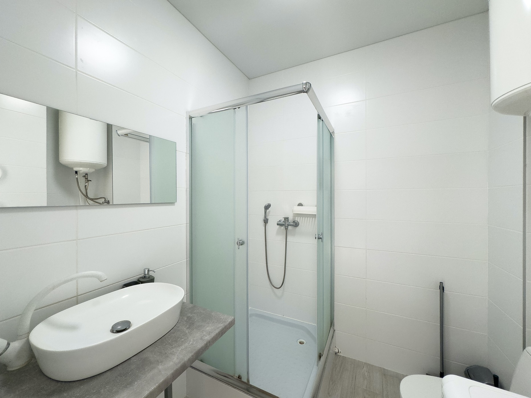 Remodeled bathroom in Bothell with walk-in shower and sliding door enclosure