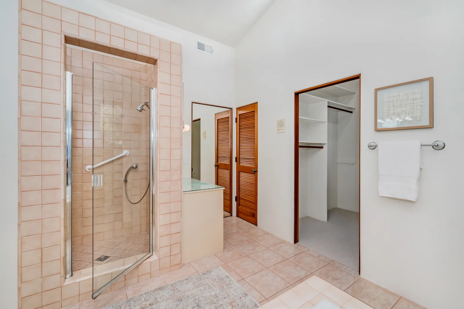Bathroom remodel in Bothell with grab bars, non-slip flooring, and walk-in shower.