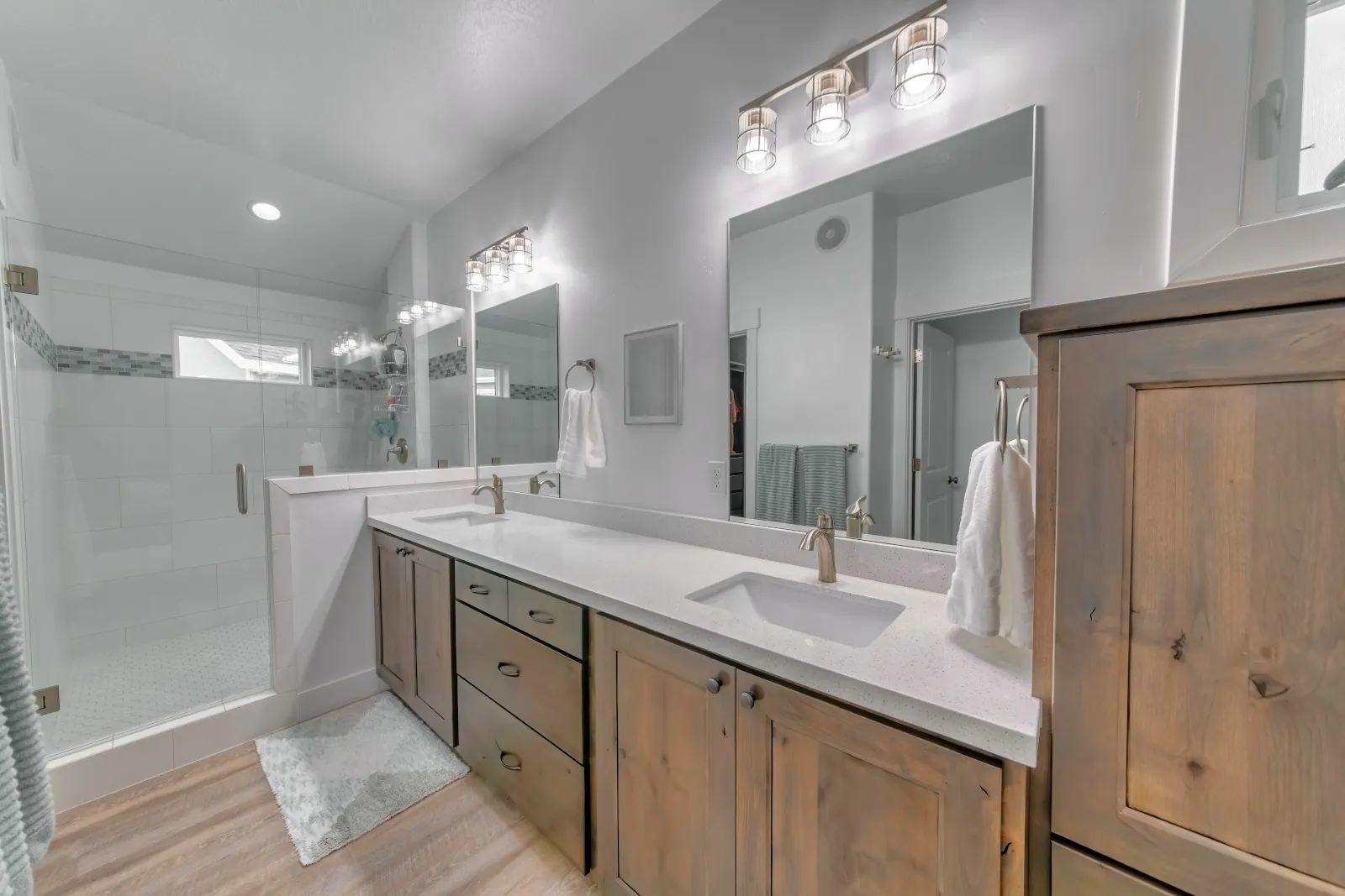 Midrange bathroom remodel in Bothell WA with new fixtures, lighting, and tile for maximum ROI