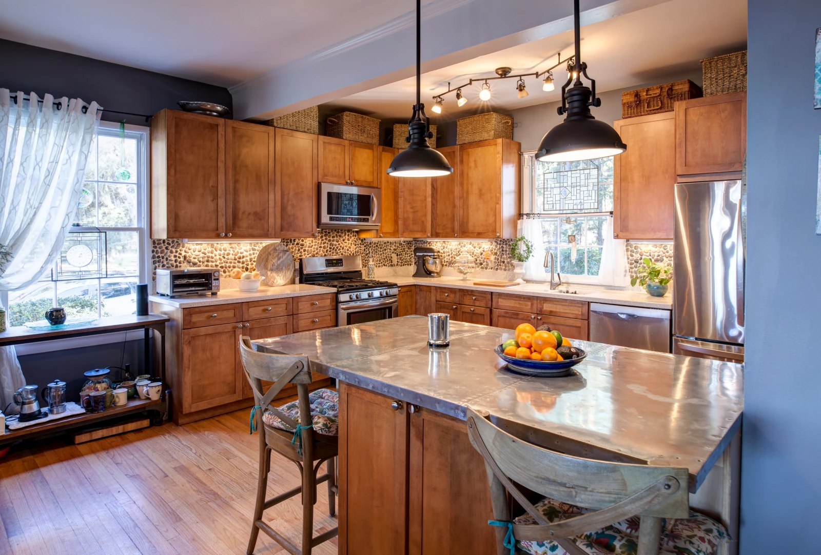Minor kitchen updates in Bothell home before listing including new hardware, painted cabinets, and updated lighting fixtures