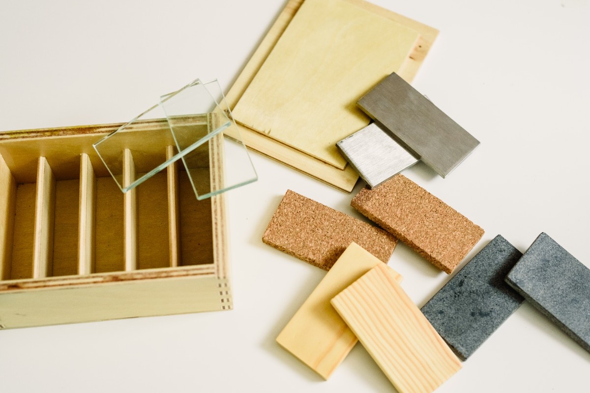 Sustainable countertop materials including bamboo and recycled glass surface samples
