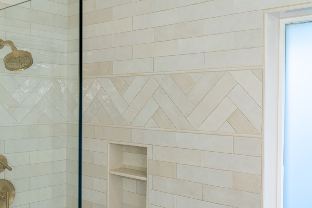 Porcelain tile wall in a frameless shower enclosure in a Bothell bathroom 