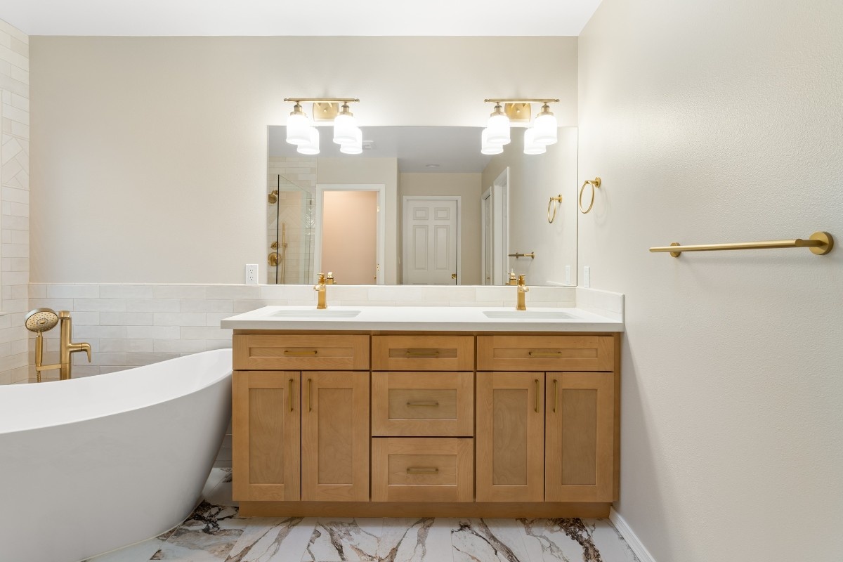 New bathroom vanity with custom-made cabinet and lighting in a Bothell bathroom 