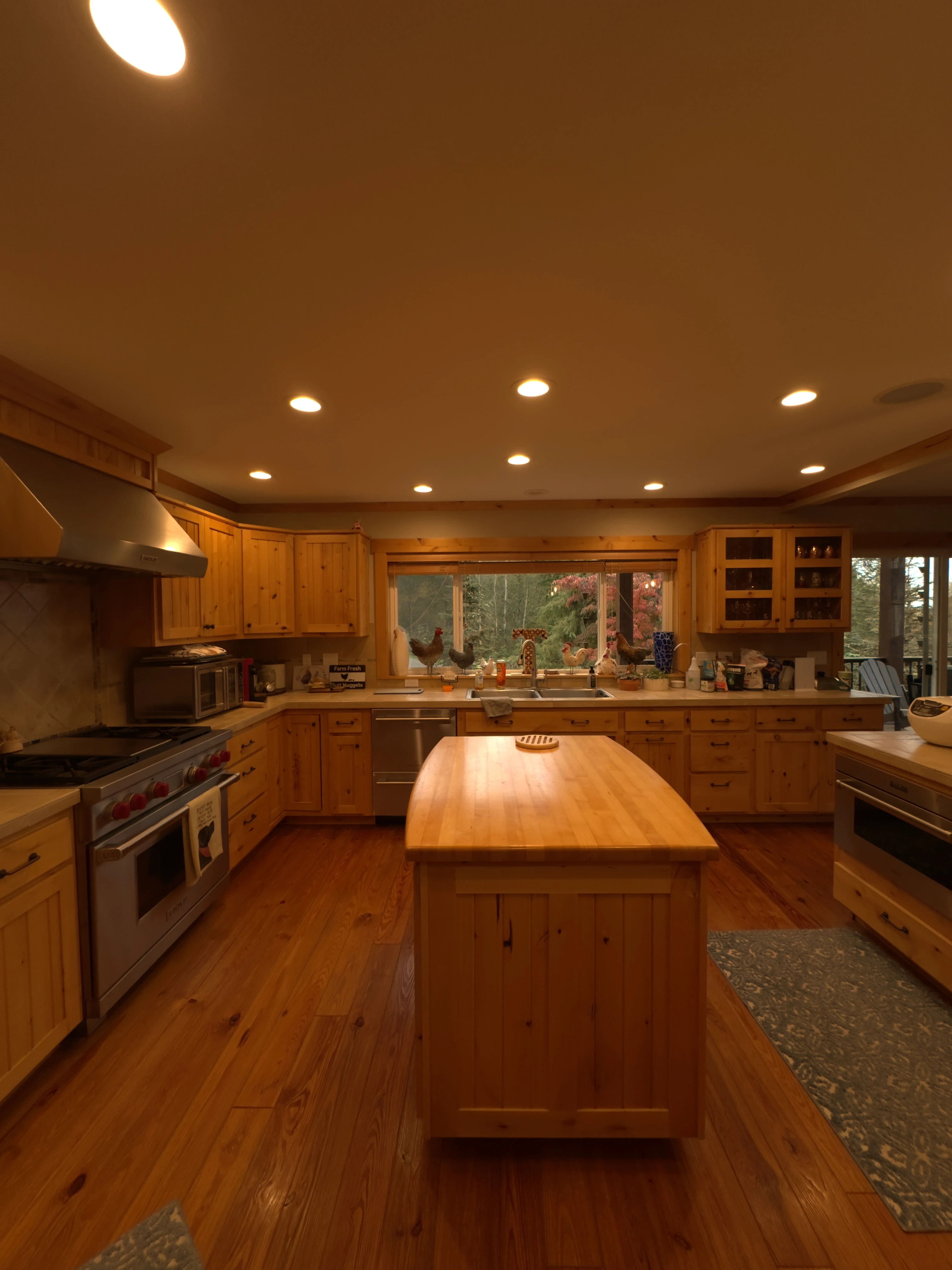 Bright renovated kitchen with open layout and wood floors