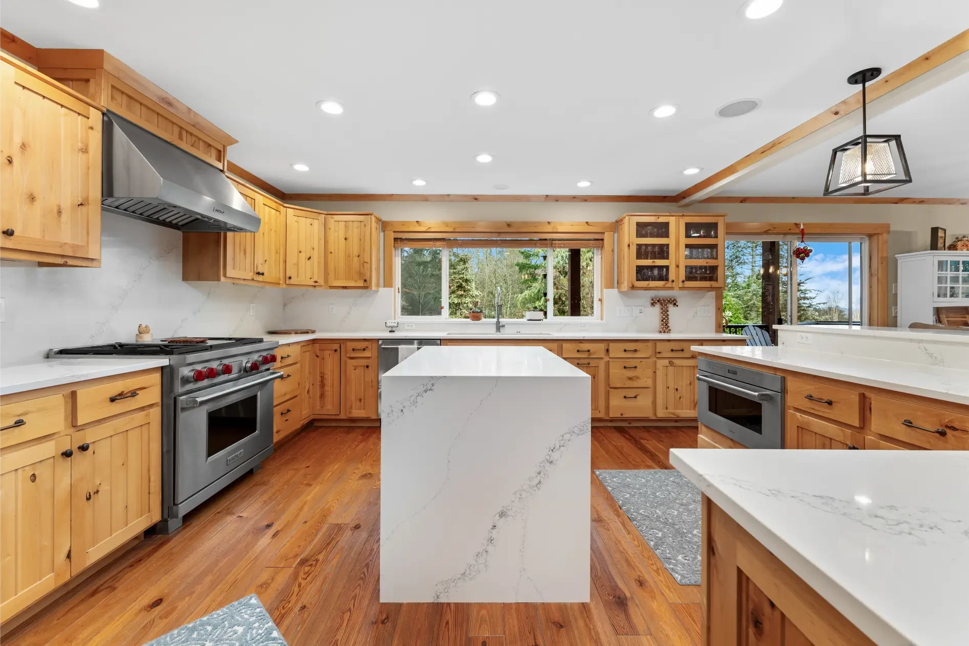 Custom kitchen cabinets with granite countertop and backsplash